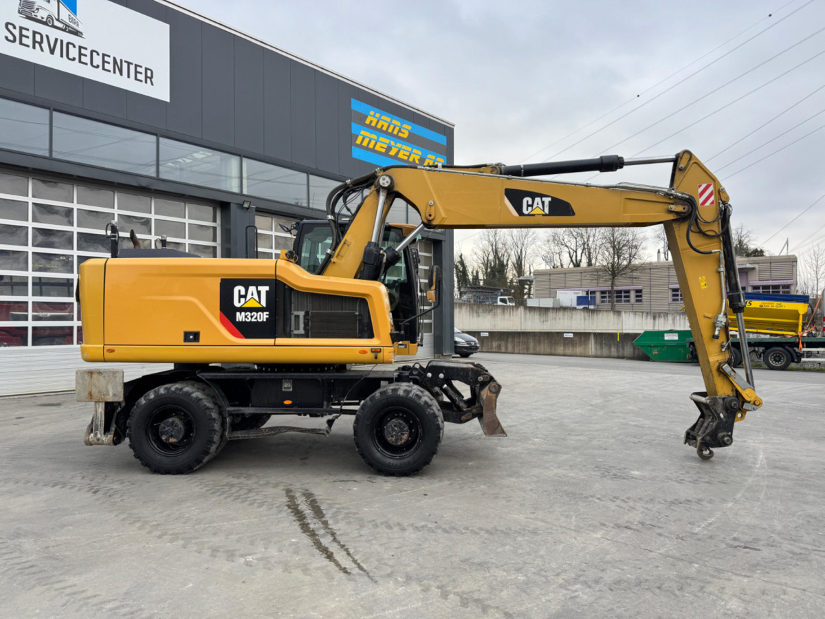 CATERPILLAR M320F Oilquick - Pyöräalustainen kaivinkone: kuva CATERPILLAR M320F Oilquick - Pyöräalustainen kaivinkone CATERPILLAR M320F Oilquick - Pyöräalustainen kaivinkone: kuva CATERPILLAR M320F Oilquick - Pyöräalustainen kaivinkone
