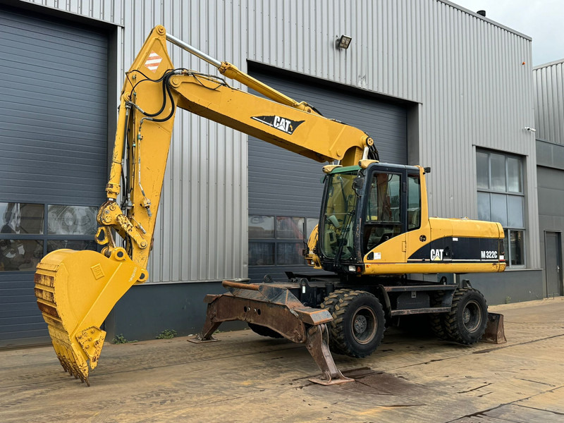 Caterpillar M322C - Hydraulic stabilizers / VA Triple boom / CE-certified, - Pyöräalustainen kaivinkone: kuva Caterpillar M322C - Hydraulic stabilizers / VA Triple boom / CE-certified, - Pyöräalustainen kaivinkone Caterpillar M322C - Hydraulic stabilizers / VA Triple boom / CE-certified, - Pyöräalustainen kaivinkone: kuva Caterpillar M322C - Hydraulic stabilizers / VA Triple boom / CE-certified, - Pyöräalustainen kaivinkone