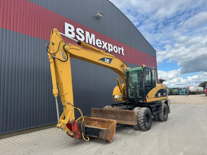 Caterpillar M 315 C - Pyöräalustainen kaivinkone: kuva Caterpillar M 315 C - Pyöräalustainen kaivinkone Caterpillar M 315 C - Pyöräalustainen kaivinkone: kuva Caterpillar M 315 C - Pyöräalustainen kaivinkone