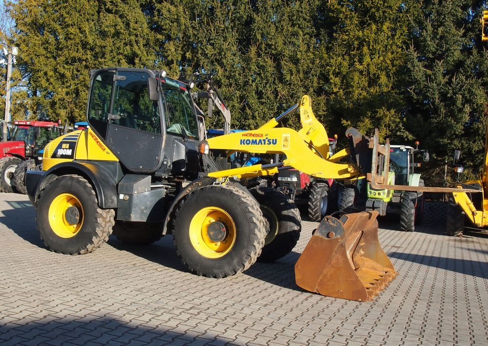 Ładowarka Komatsu WA100M 2007 Ładowarka Komatsu - Pyöräkuormaaja: kuva Ładowarka Komatsu WA100M 2007 Ładowarka Komatsu - Pyöräkuormaaja Ładowarka Komatsu WA100M 2007 Ładowarka Komatsu - Pyöräkuormaaja: kuva Ładowarka Komatsu WA100M 2007 Ładowarka Komatsu - Pyöräkuormaaja