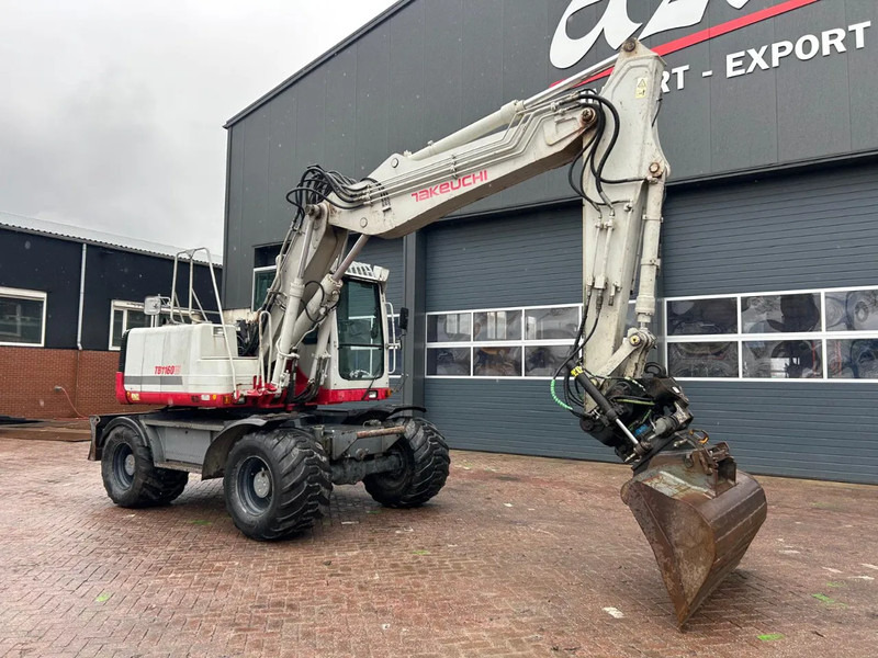 Takeuchi TB1160W - Pyöräalustainen kaivinkone: kuva Takeuchi TB1160W - Pyöräalustainen kaivinkone Takeuchi TB1160W - Pyöräalustainen kaivinkone: kuva Takeuchi TB1160W - Pyöräalustainen kaivinkone