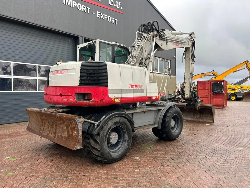 Takeuchi TB1160W - Pyöräalustainen kaivinkone: kuva Takeuchi TB1160W - Pyöräalustainen kaivinkone Takeuchi TB1160W - Pyöräalustainen kaivinkone: kuva Takeuchi TB1160W - Pyöräalustainen kaivinkone