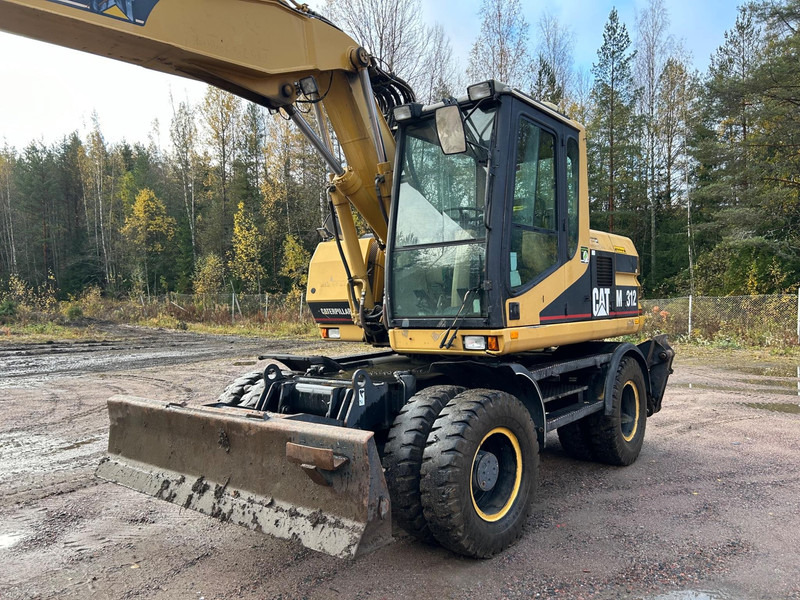 Caterpillar M312 Engcon EC20 tiltrotator - Pyöräalustainen kaivinkone: kuva Caterpillar M312 Engcon EC20 tiltrotator - Pyöräalustainen kaivinkone Caterpillar M312 Engcon EC20 tiltrotator - Pyöräalustainen kaivinkone: kuva Caterpillar M312 Engcon EC20 tiltrotator - Pyöräalustainen kaivinkone