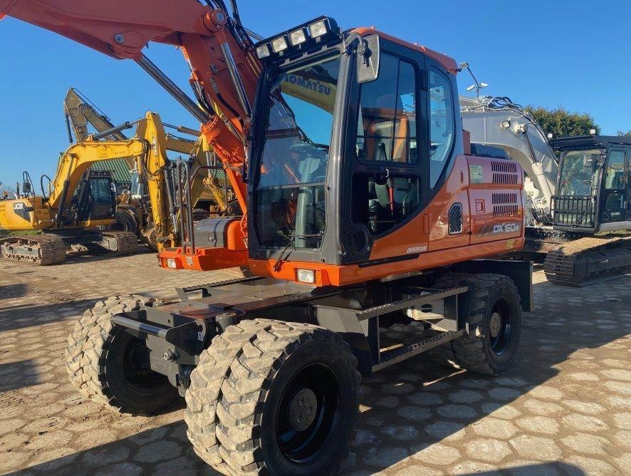 Doosan DX160W-3 - Pyöräalustainen kaivinkone: kuva Doosan DX160W-3 - Pyöräalustainen kaivinkone Doosan DX160W-3 - Pyöräalustainen kaivinkone: kuva Doosan DX160W-3 - Pyöräalustainen kaivinkone