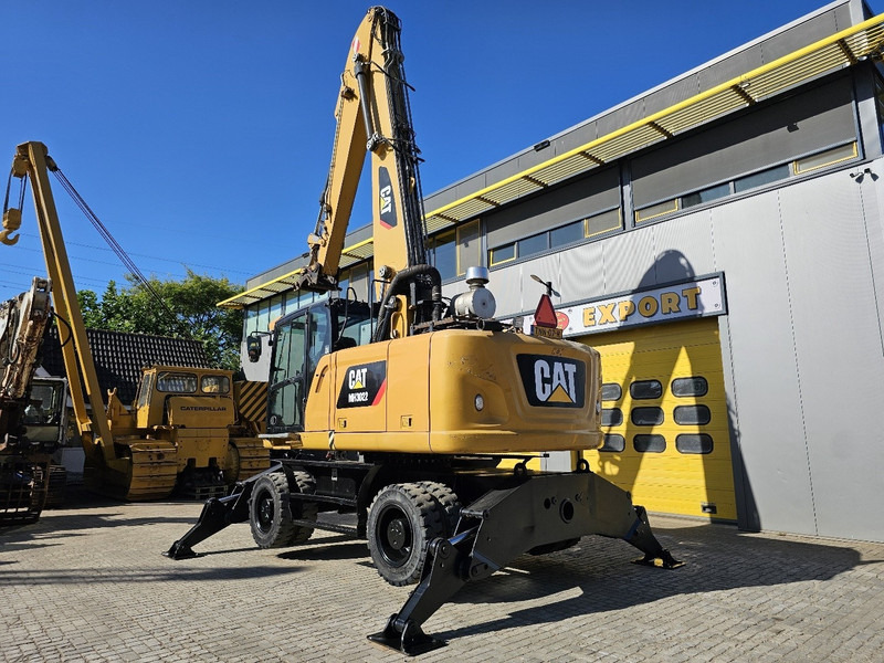 Caterpillar MH 3022 - Pyöräalustainen kaivinkone: kuva Caterpillar MH 3022 - Pyöräalustainen kaivinkone Caterpillar MH 3022 - Pyöräalustainen kaivinkone: kuva Caterpillar MH 3022 - Pyöräalustainen kaivinkone