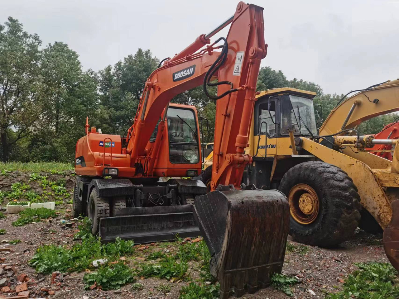 DOOSAN DH150W-7 - Pyöräalustainen kaivinkone: kuva DOOSAN DH150W-7 - Pyöräalustainen kaivinkone DOOSAN DH150W-7 - Pyöräalustainen kaivinkone: kuva DOOSAN DH150W-7 - Pyöräalustainen kaivinkone