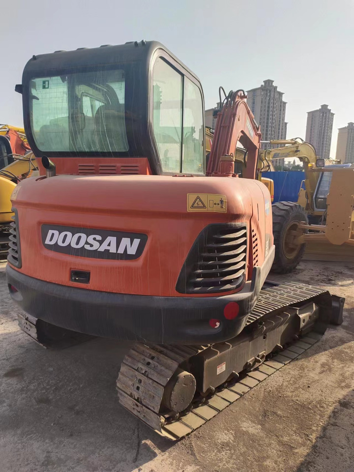 DOOSAN DX60 - Minikuormaaja: kuva DOOSAN DX60 - Minikuormaaja DOOSAN DX60 - Minikuormaaja: kuva DOOSAN DX60 - Minikuormaaja