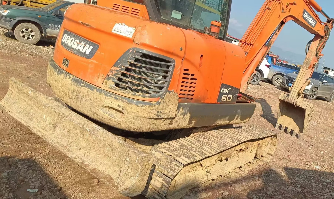DOOSAN dx60 - Minikuormaaja: kuva DOOSAN dx60 - Minikuormaaja DOOSAN dx60 - Minikuormaaja: kuva DOOSAN dx60 - Minikuormaaja