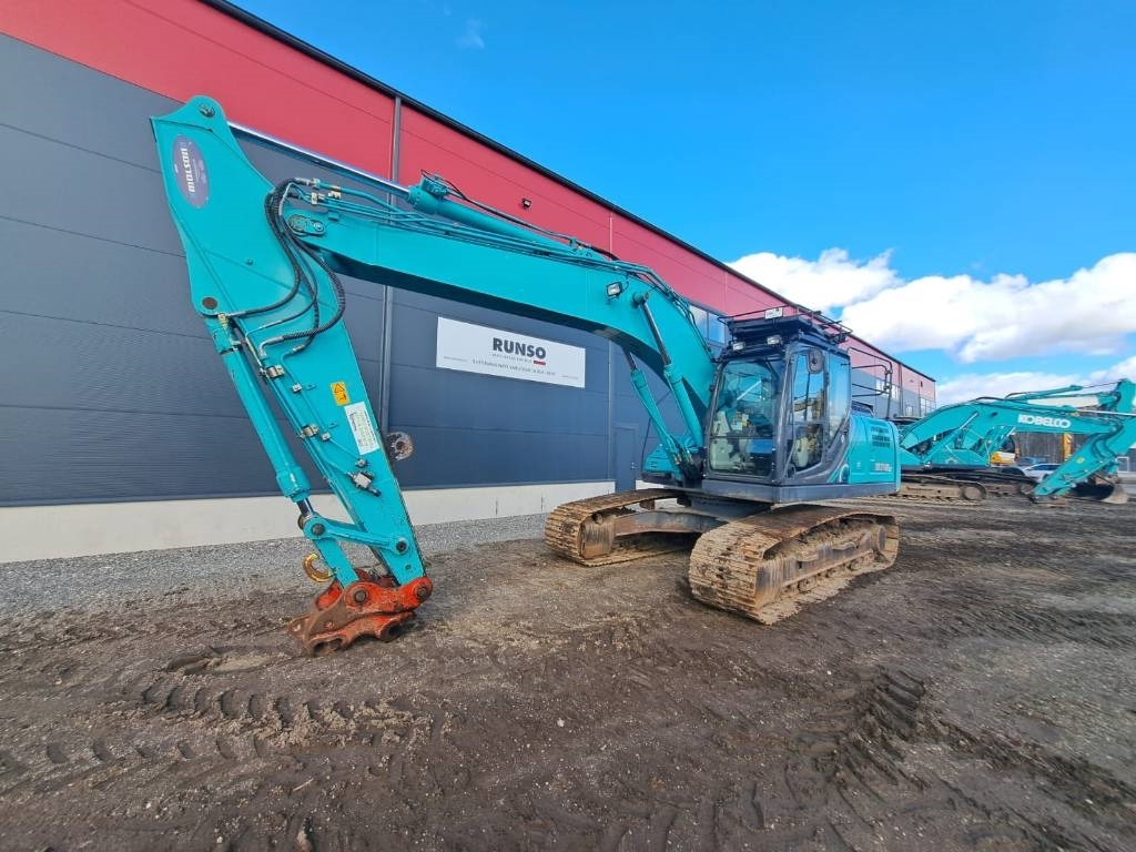 Kobelco SK 210-10 - Telakaivukone: kuva Kobelco SK 210-10 - Telakaivukone Kobelco SK 210-10 - Telakaivukone: kuva Kobelco SK 210-10 - Telakaivukone