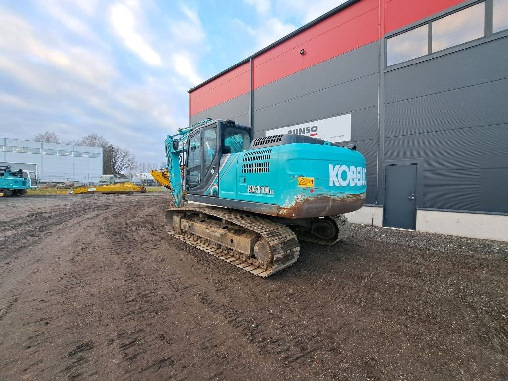 Kobelco SK 210 LC-10 - Telakaivukone: kuva Kobelco SK 210 LC-10 - Telakaivukone Kobelco SK 210 LC-10 - Telakaivukone: kuva Kobelco SK 210 LC-10 - Telakaivukone