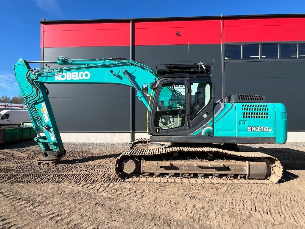 Kobelco SK 210 LC-10E - Telakaivukone: kuva Kobelco SK 210 LC-10E - Telakaivukone Kobelco SK 210 LC-10E - Telakaivukone: kuva Kobelco SK 210 LC-10E - Telakaivukone