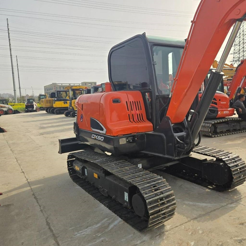 Doosan DX 60-9 C - Minikuormaaja: kuva Doosan DX 60-9 C - Minikuormaaja Doosan DX 60-9 C - Minikuormaaja: kuva Doosan DX 60-9 C - Minikuormaaja