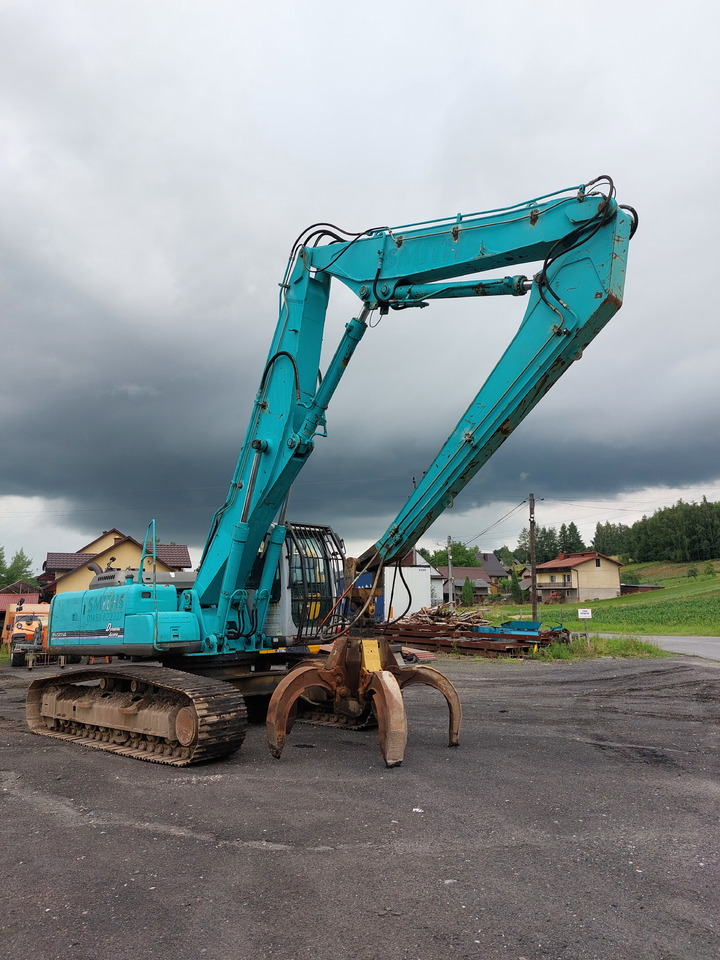 KOBELCO SK220 - Materiaalinkäsittelykone: kuva KOBELCO SK220 - Materiaalinkäsittelykone KOBELCO SK220 - Materiaalinkäsittelykone: kuva KOBELCO SK220 - Materiaalinkäsittelykone