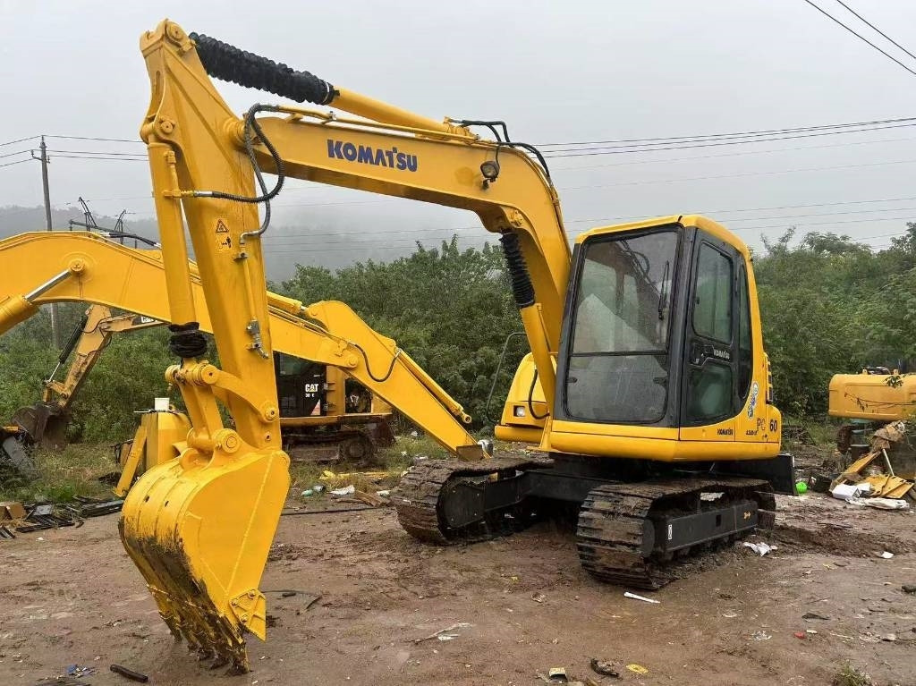Komatsu PC 60 - Minikuormaaja: kuva Komatsu PC 60 - Minikuormaaja Komatsu PC 60 - Minikuormaaja: kuva Komatsu PC 60 - Minikuormaaja