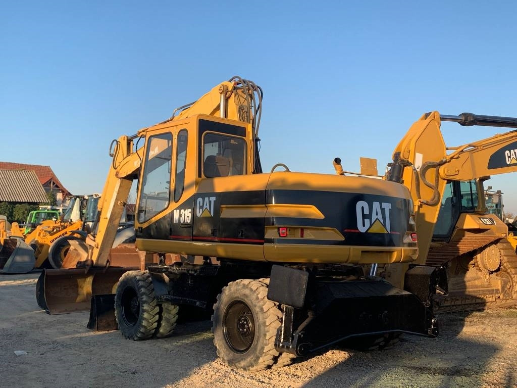 CAT M 315 - Pyöräalustainen kaivinkone: kuva CAT M 315 - Pyöräalustainen kaivinkone CAT M 315 - Pyöräalustainen kaivinkone: kuva CAT M 315 - Pyöräalustainen kaivinkone