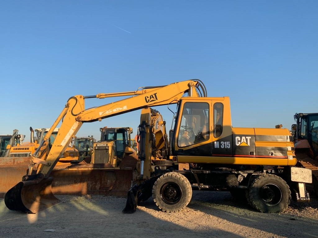 CAT M 315 - Pyöräalustainen kaivinkone: kuva CAT M 315 - Pyöräalustainen kaivinkone CAT M 315 - Pyöräalustainen kaivinkone: kuva CAT M 315 - Pyöräalustainen kaivinkone