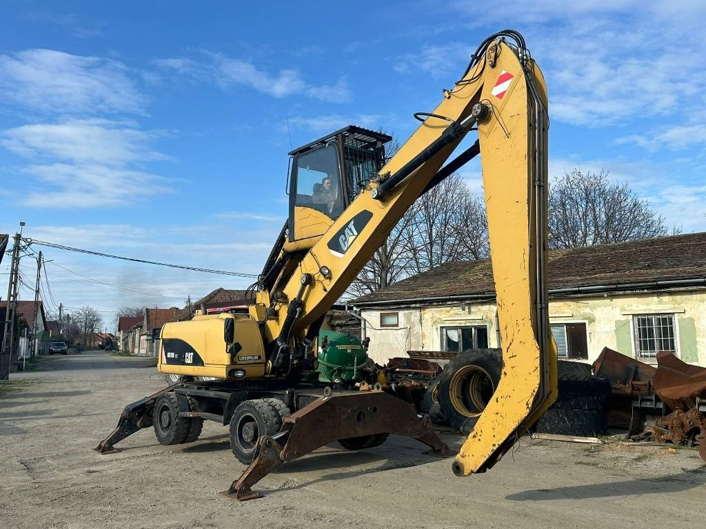 CAT M 318 D MH - Materiaalinkäsittelykone: kuva CAT M 318 D MH - Materiaalinkäsittelykone CAT M 318 D MH - Materiaalinkäsittelykone: kuva CAT M 318 D MH - Materiaalinkäsittelykone