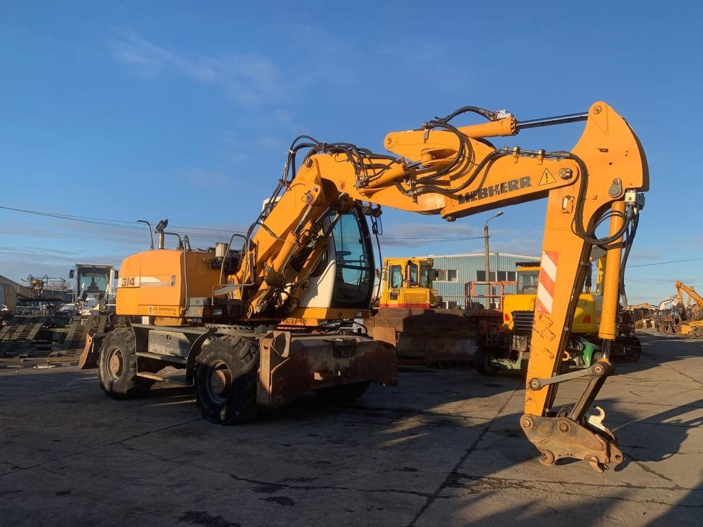 Liebherr A 314 Litronic - Pyöräalustainen kaivinkone: kuva Liebherr A 314 Litronic - Pyöräalustainen kaivinkone Liebherr A 314 Litronic - Pyöräalustainen kaivinkone: kuva Liebherr A 314 Litronic - Pyöräalustainen kaivinkone