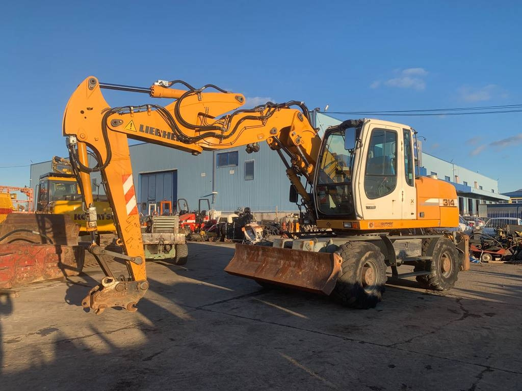 Liebherr A 314 Litronic - Pyöräalustainen kaivinkone: kuva Liebherr A 314 Litronic - Pyöräalustainen kaivinkone Liebherr A 314 Litronic - Pyöräalustainen kaivinkone: kuva Liebherr A 314 Litronic - Pyöräalustainen kaivinkone