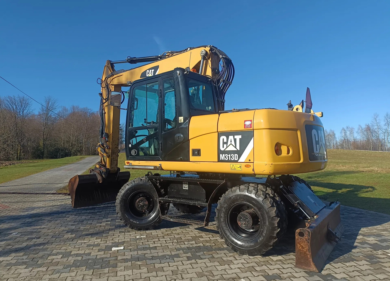 CATERPILLAR M313D - Pyöräalustainen kaivinkone: kuva CATERPILLAR M313D - Pyöräalustainen kaivinkone CATERPILLAR M313D - Pyöräalustainen kaivinkone: kuva CATERPILLAR M313D - Pyöräalustainen kaivinkone