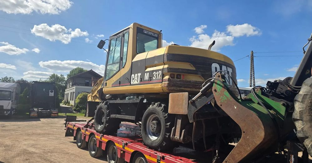 Caterpillar M312 - Pyöräalustainen kaivinkone: kuva Caterpillar M312 - Pyöräalustainen kaivinkone Caterpillar M312 - Pyöräalustainen kaivinkone: kuva Caterpillar M312 - Pyöräalustainen kaivinkone
