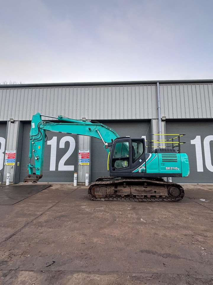 Kobelco SK210LC-10 - Telakaivukone: kuva Kobelco SK210LC-10 - Telakaivukone Kobelco SK210LC-10 - Telakaivukone: kuva Kobelco SK210LC-10 - Telakaivukone