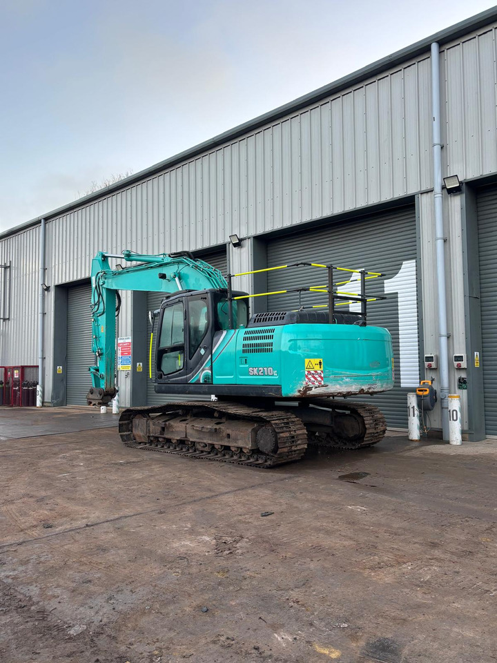 Kobelco SK210LC-10 - Telakaivukone: kuva Kobelco SK210LC-10 - Telakaivukone Kobelco SK210LC-10 - Telakaivukone: kuva Kobelco SK210LC-10 - Telakaivukone