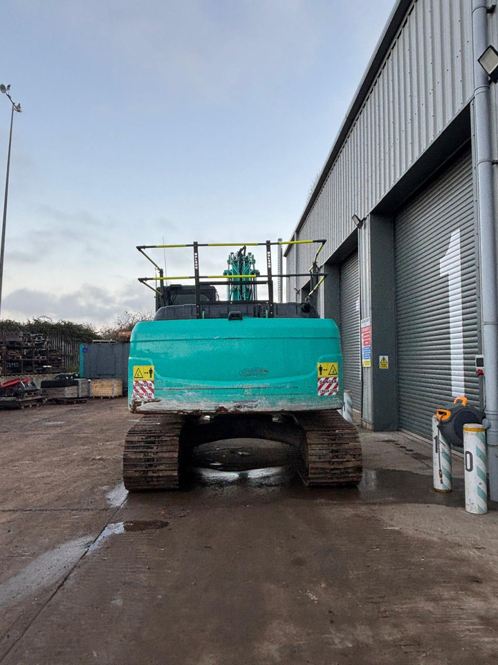 Kobelco SK210LC-10 - Telakaivukone: kuva Kobelco SK210LC-10 - Telakaivukone Kobelco SK210LC-10 - Telakaivukone: kuva Kobelco SK210LC-10 - Telakaivukone