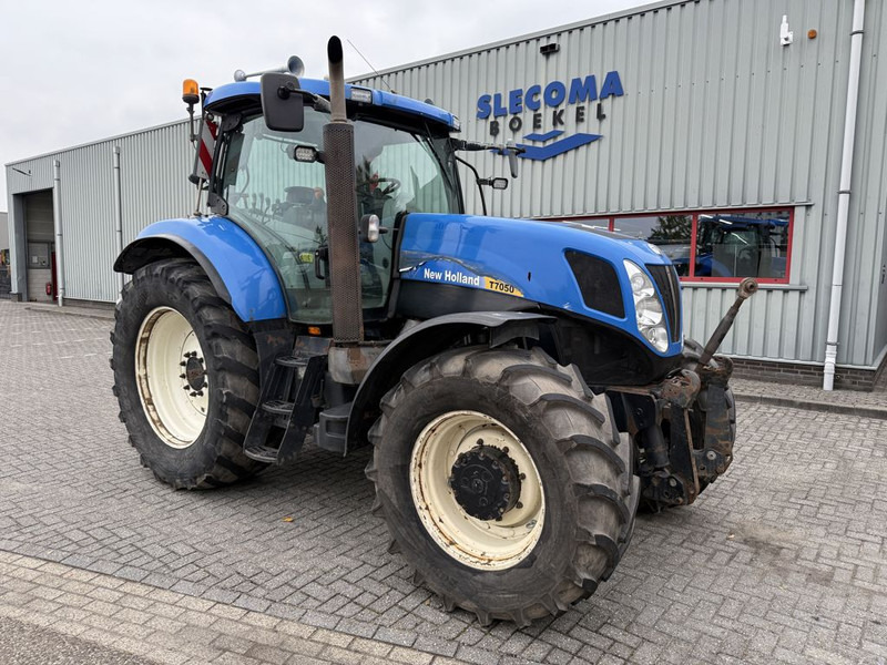 New Holland T7050 Power Command - Traktori: kuva New Holland T7050 Power Command - Traktori New Holland T7050 Power Command - Traktori: kuva New Holland T7050 Power Command - Traktori