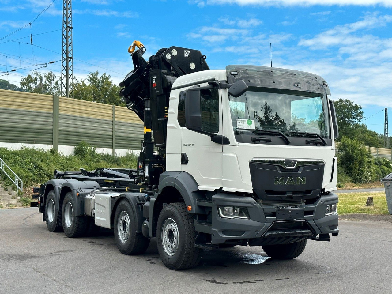 Koukkulava kuorma-auto, Nosturiauto MAN TGS 35.520 8x4  Abrollkipper + Kran HIAB 658E6: kuva Koukkulava kuorma-auto, Nosturiauto MAN TGS 35.520 8x4  Abrollkipper + Kran HIAB 658E6