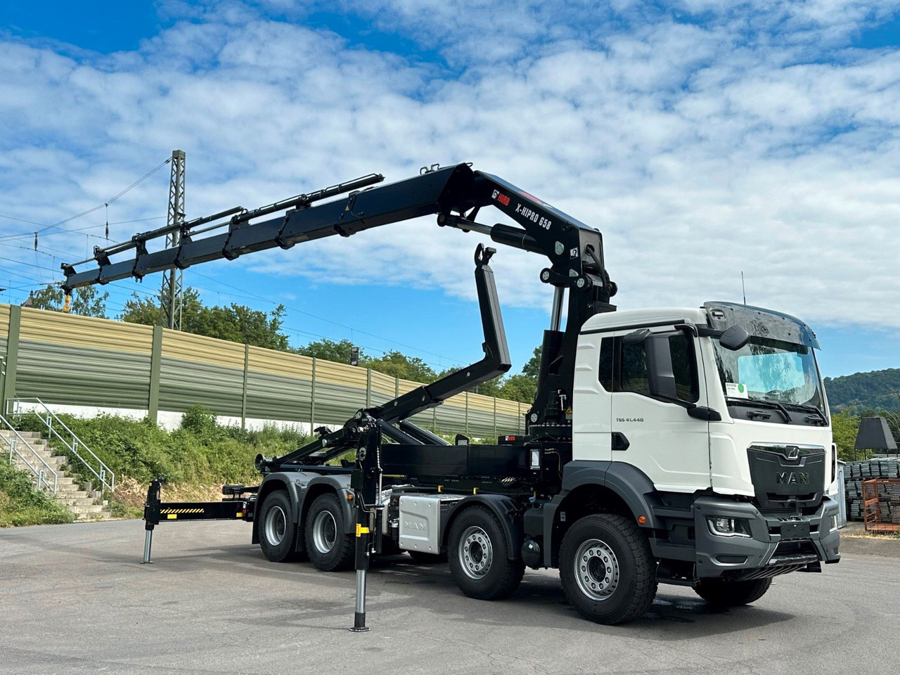 Koukkulava kuorma-auto, Nosturiauto MAN TGS 35.520 8x4  Abrollkipper + Kran HIAB 658E6: kuva Koukkulava kuorma-auto, Nosturiauto MAN TGS 35.520 8x4  Abrollkipper + Kran HIAB 658E6