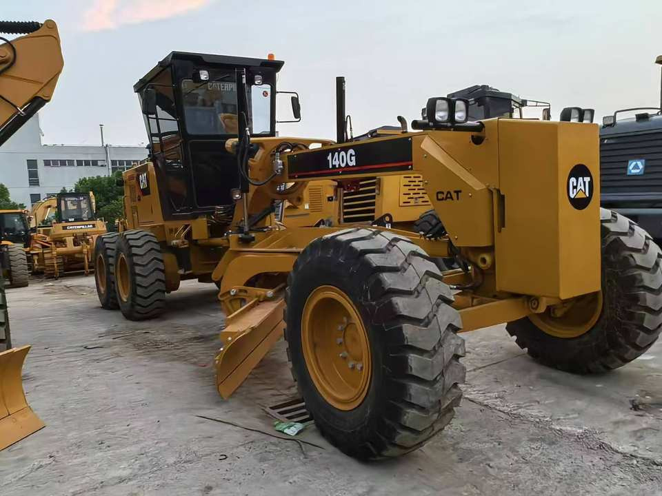 Second Hand Used Construction Machinery Japanese CAT 140G Grader Caterpillar Brand for Sale With Good Condition and Price - Tiehöylä: kuva Second Hand Used Construction Machinery Japanese CAT 140G Grader Caterpillar Brand for Sale With Good Condition and Price - Tiehöylä Second Hand Used Construction Machinery Japanese CAT 140G Grader Caterpillar Brand for Sale With Good Condition and Price - Tiehöylä: kuva Second Hand Used Construction Machinery Japanese CAT 140G Grader Caterpillar Brand for Sale With Good Condition and Price - Tiehöylä