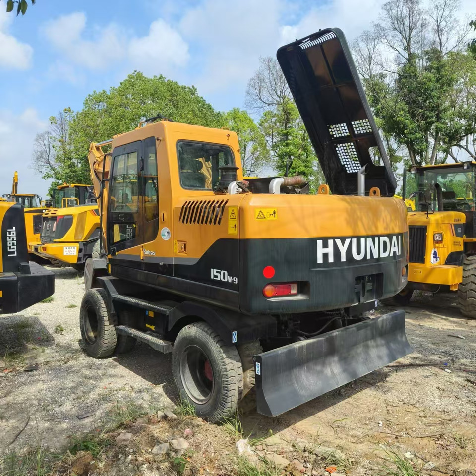 Hyundai R150W-7 - Pyöräalustainen kaivinkone: kuva Hyundai R150W-7 - Pyöräalustainen kaivinkone Hyundai R150W-7 - Pyöräalustainen kaivinkone: kuva Hyundai R150W-7 - Pyöräalustainen kaivinkone