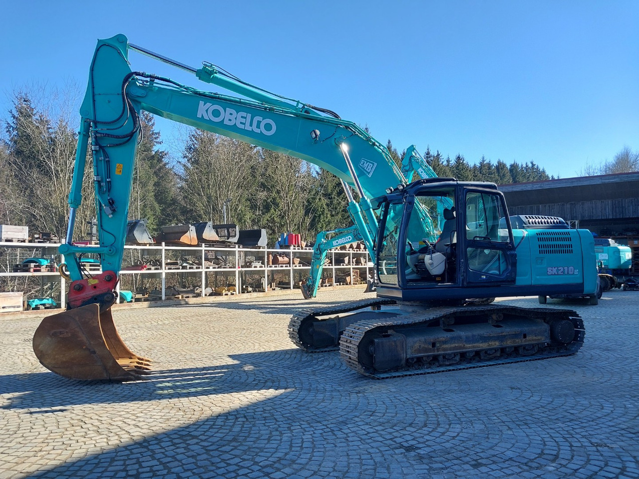 Kobelco SK210LC-10 - Telakaivukone: kuva Kobelco SK210LC-10 - Telakaivukone Kobelco SK210LC-10 - Telakaivukone: kuva Kobelco SK210LC-10 - Telakaivukone