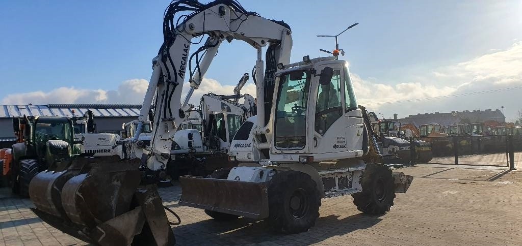 Mecalac 714 MWE - Pyöräalustainen kaivinkone: kuva Mecalac 714 MWE - Pyöräalustainen kaivinkone Mecalac 714 MWE - Pyöräalustainen kaivinkone: kuva Mecalac 714 MWE - Pyöräalustainen kaivinkone