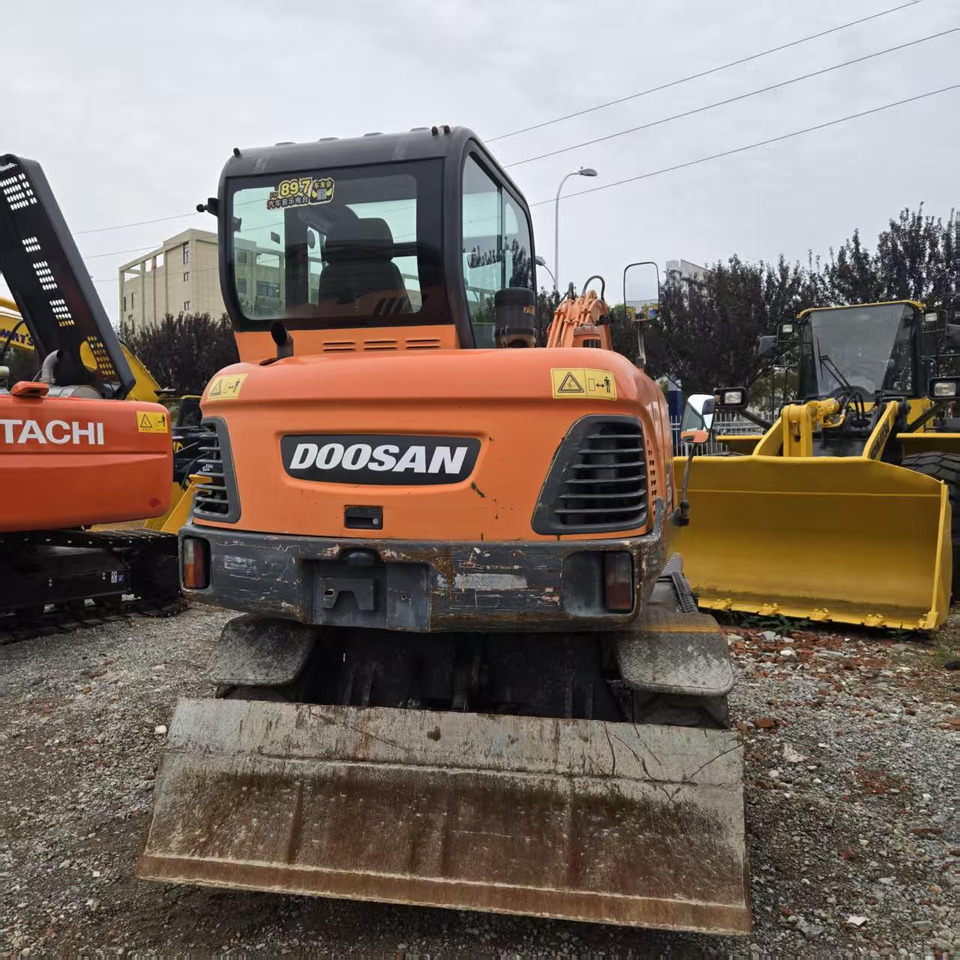 DOOSAN DX60W - Pyöräalustainen kaivinkone: kuva DOOSAN DX60W - Pyöräalustainen kaivinkone DOOSAN DX60W - Pyöräalustainen kaivinkone: kuva DOOSAN DX60W - Pyöräalustainen kaivinkone