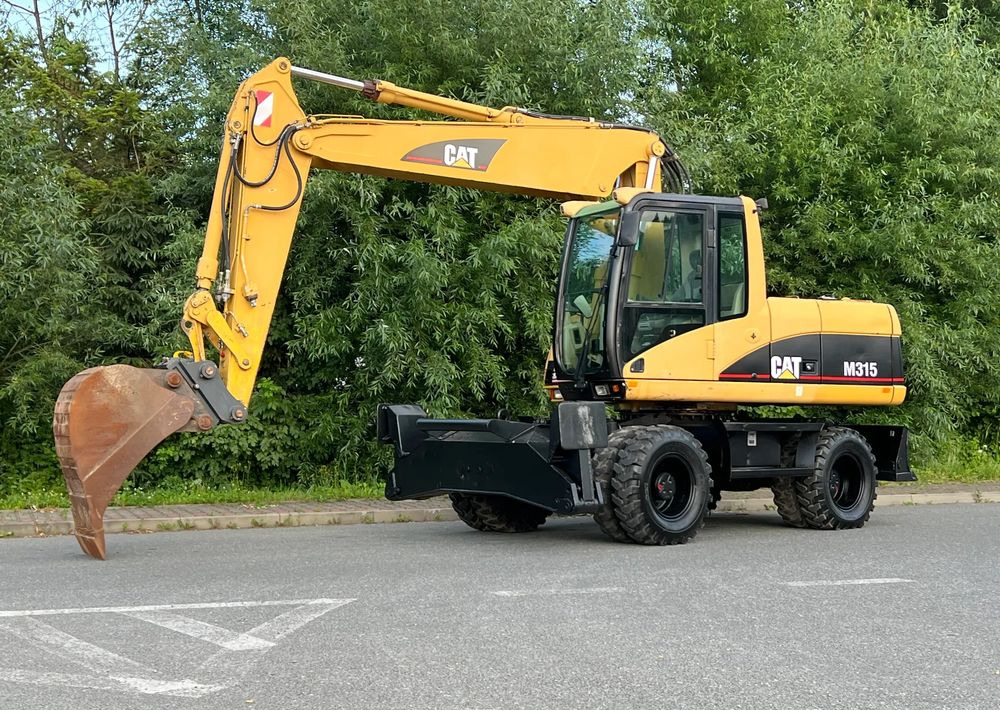 Caterpillar CAT M315C CATERPILLAR SPROWADZONY Bardzo Dobry Stan - Pyöräalustainen kaivinkone: kuva Caterpillar CAT M315C CATERPILLAR SPROWADZONY Bardzo Dobry Stan - Pyöräalustainen kaivinkone Caterpillar CAT M315C CATERPILLAR SPROWADZONY Bardzo Dobry Stan - Pyöräalustainen kaivinkone: kuva Caterpillar CAT M315C CATERPILLAR SPROWADZONY Bardzo Dobry Stan - Pyöräalustainen kaivinkone
