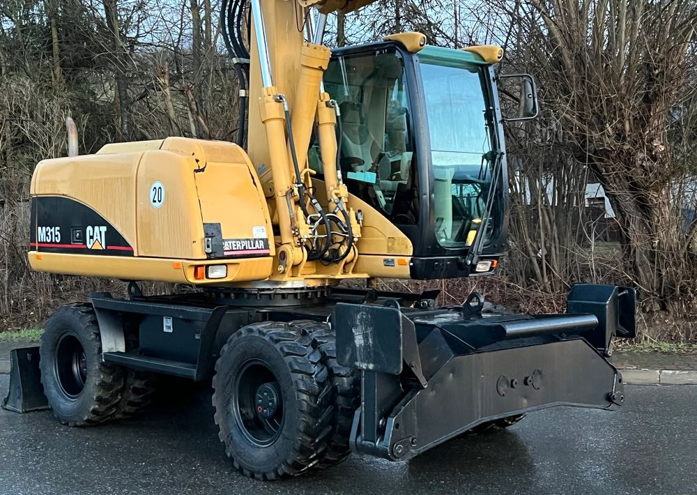 Caterpillar CAT M315C CATERPILLAR SPROWADZONY Bardzo Dobry Stan - Pyöräalustainen kaivinkone: kuva Caterpillar CAT M315C CATERPILLAR SPROWADZONY Bardzo Dobry Stan - Pyöräalustainen kaivinkone Caterpillar CAT M315C CATERPILLAR SPROWADZONY Bardzo Dobry Stan - Pyöräalustainen kaivinkone: kuva Caterpillar CAT M315C CATERPILLAR SPROWADZONY Bardzo Dobry Stan - Pyöräalustainen kaivinkone