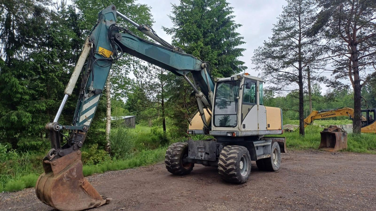 Volvo EW140 - Pyöräalustainen kaivinkone: kuva Volvo EW140 - Pyöräalustainen kaivinkone Volvo EW140 - Pyöräalustainen kaivinkone: kuva Volvo EW140 - Pyöräalustainen kaivinkone