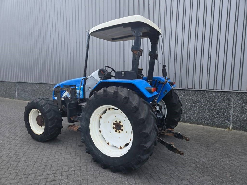 New Holland TL 90 A - Traktori: kuva New Holland TL 90 A - Traktori New Holland TL 90 A - Traktori: kuva New Holland TL 90 A - Traktori