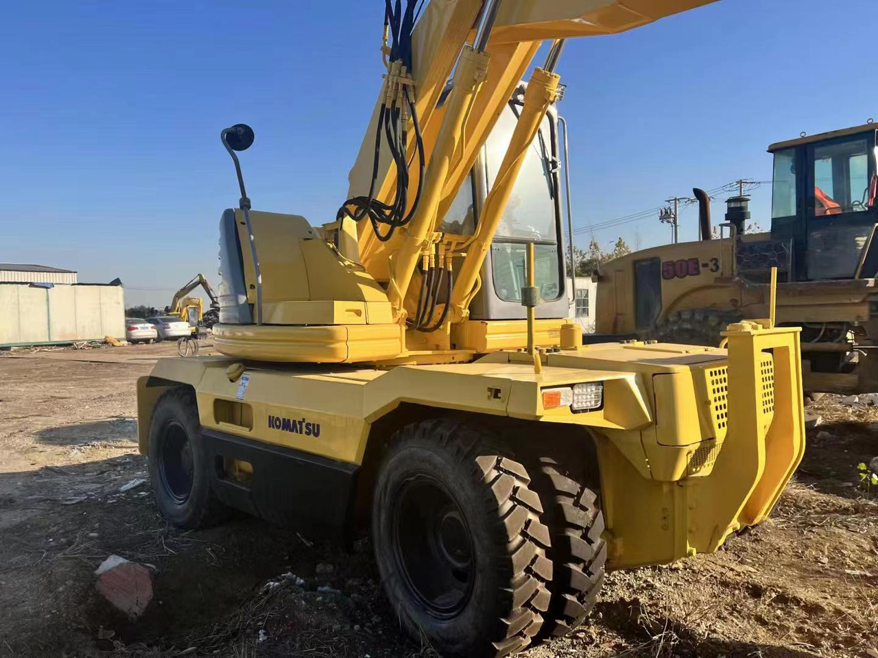 KOMATSU PC128US - Pyöräalustainen kaivinkone: kuva KOMATSU PC128US - Pyöräalustainen kaivinkone KOMATSU PC128US - Pyöräalustainen kaivinkone: kuva KOMATSU PC128US - Pyöräalustainen kaivinkone