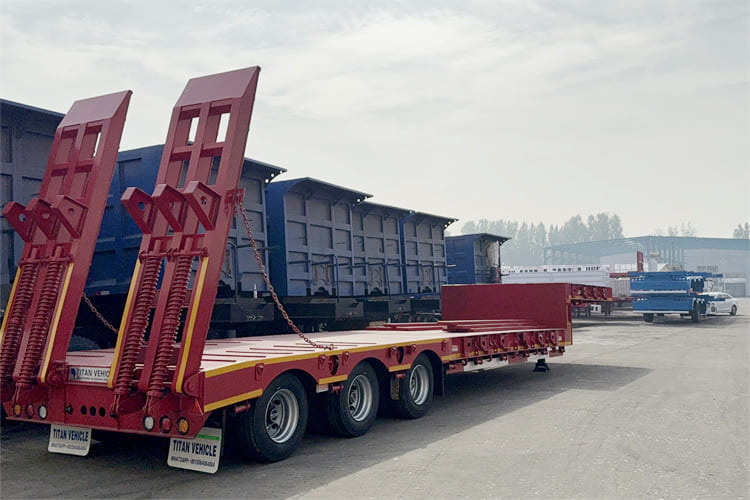 TITAN 100t Lowbed Trailer for Sale in Tanzania - Apuvaunu puoliperävaunu: kuva TITAN 100t Lowbed Trailer for Sale in Tanzania - Apuvaunu puoliperävaunu TITAN 100t Lowbed Trailer for Sale in Tanzania - Apuvaunu puoliperävaunu: kuva TITAN 100t Lowbed Trailer for Sale in Tanzania - Apuvaunu puoliperävaunu