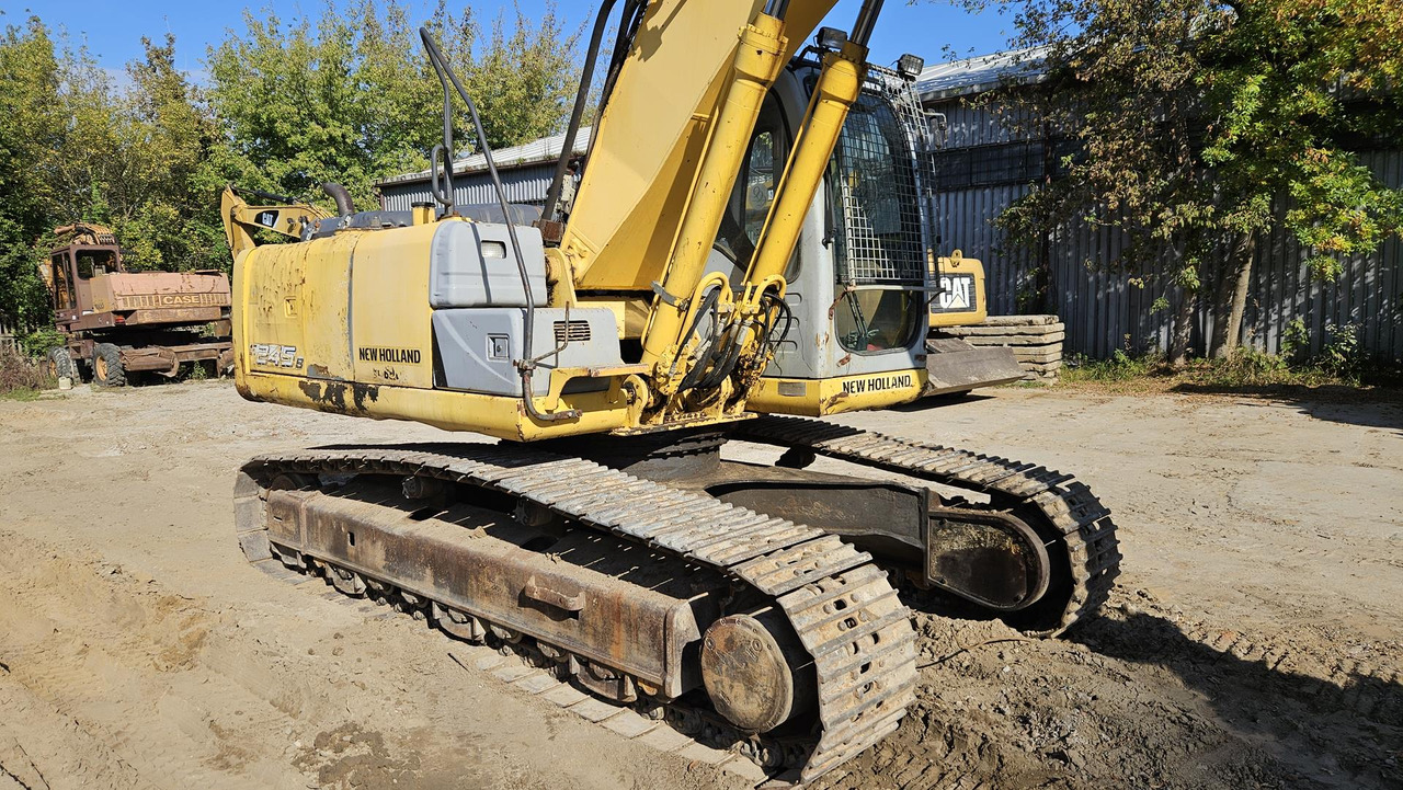 Telakaivukone NEW HOLLAND E 245 B: kuva Telakaivukone NEW HOLLAND E 245 B Telakaivukone NEW HOLLAND E 245 B: kuva Telakaivukone NEW HOLLAND E 245 B