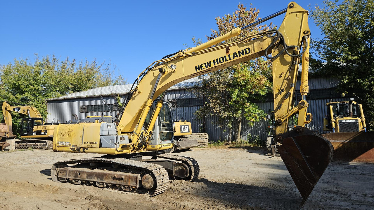 NEW HOLLAND E 245 B - Telakaivukone: kuva NEW HOLLAND E 245 B - Telakaivukone NEW HOLLAND E 245 B - Telakaivukone: kuva NEW HOLLAND E 245 B - Telakaivukone