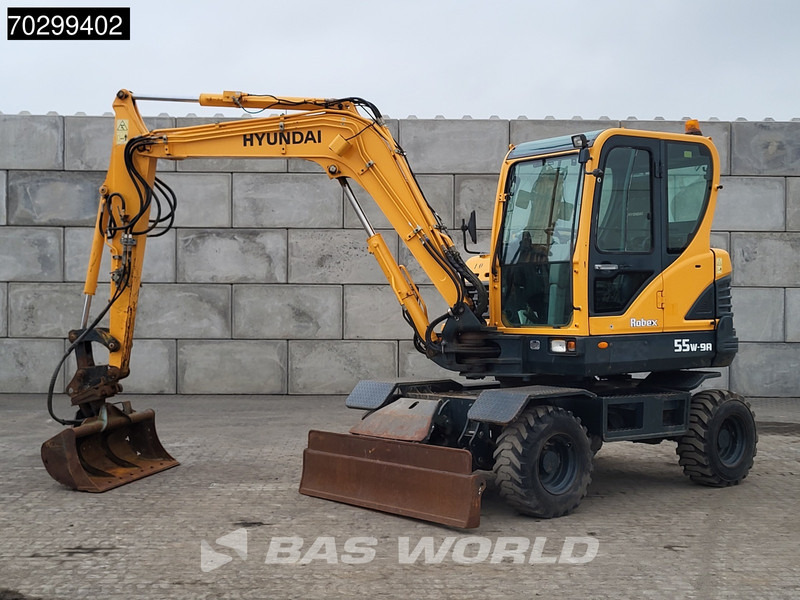 Hyundai Robex 55W-9A EPA - Pyöräalustainen kaivinkone: kuva Hyundai Robex 55W-9A EPA - Pyöräalustainen kaivinkone Hyundai Robex 55W-9A EPA - Pyöräalustainen kaivinkone: kuva Hyundai Robex 55W-9A EPA - Pyöräalustainen kaivinkone