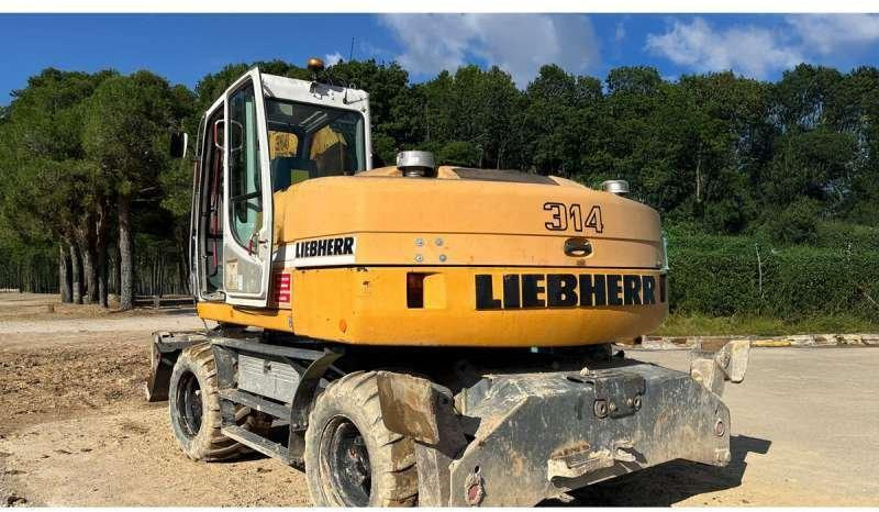 Liebherr A314 Litronic - Pyöräalustainen kaivinkone: kuva Liebherr A314 Litronic - Pyöräalustainen kaivinkone Liebherr A314 Litronic - Pyöräalustainen kaivinkone: kuva Liebherr A314 Litronic - Pyöräalustainen kaivinkone