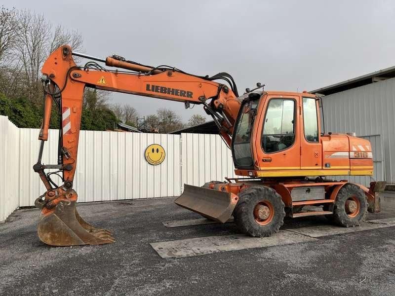 Liebherr A316 LITRONIC - Pyöräalustainen kaivinkone: kuva Liebherr A316 LITRONIC - Pyöräalustainen kaivinkone Liebherr A316 LITRONIC - Pyöräalustainen kaivinkone: kuva Liebherr A316 LITRONIC - Pyöräalustainen kaivinkone