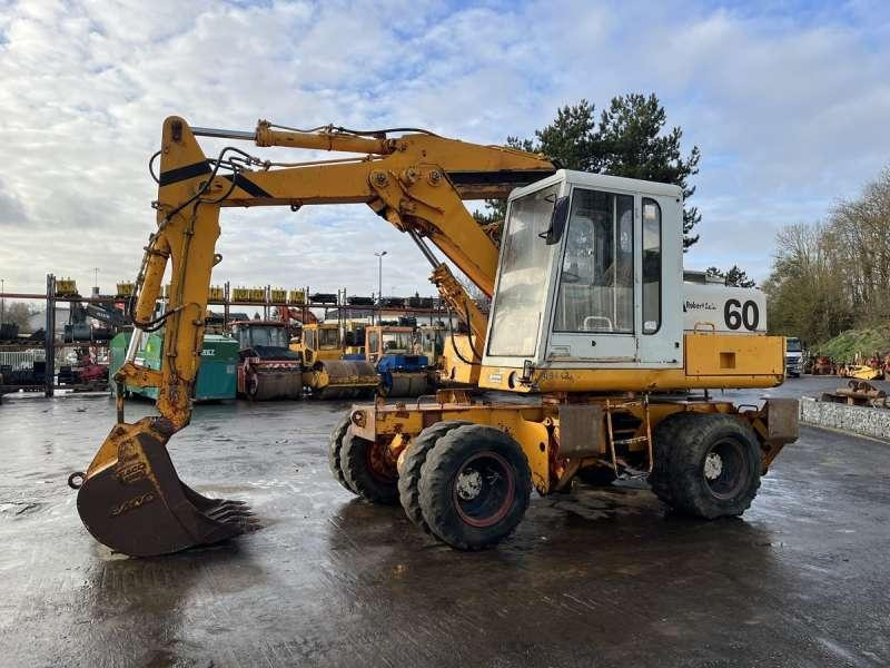 Poclain P60 - Pyöräalustainen kaivinkone: kuva Poclain P60 - Pyöräalustainen kaivinkone Poclain P60 - Pyöräalustainen kaivinkone: kuva Poclain P60 - Pyöräalustainen kaivinkone