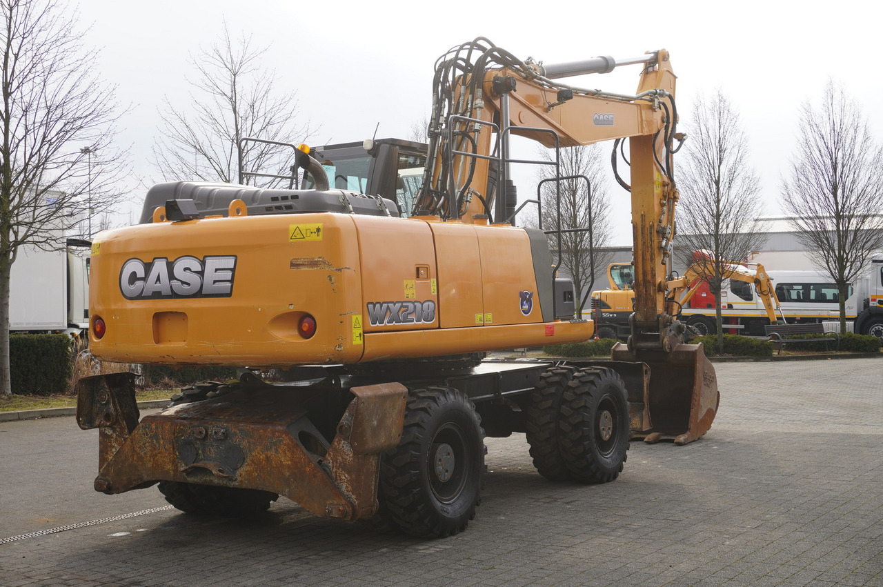 CASE WX218 / 23t wheeled excavator / 3 times folding arm - Pyöräalustainen kaivinkone: kuva CASE WX218 / 23t wheeled excavator / 3 times folding arm - Pyöräalustainen kaivinkone CASE WX218 / 23t wheeled excavator / 3 times folding arm - Pyöräalustainen kaivinkone: kuva CASE WX218 / 23t wheeled excavator / 3 times folding arm - Pyöräalustainen kaivinkone