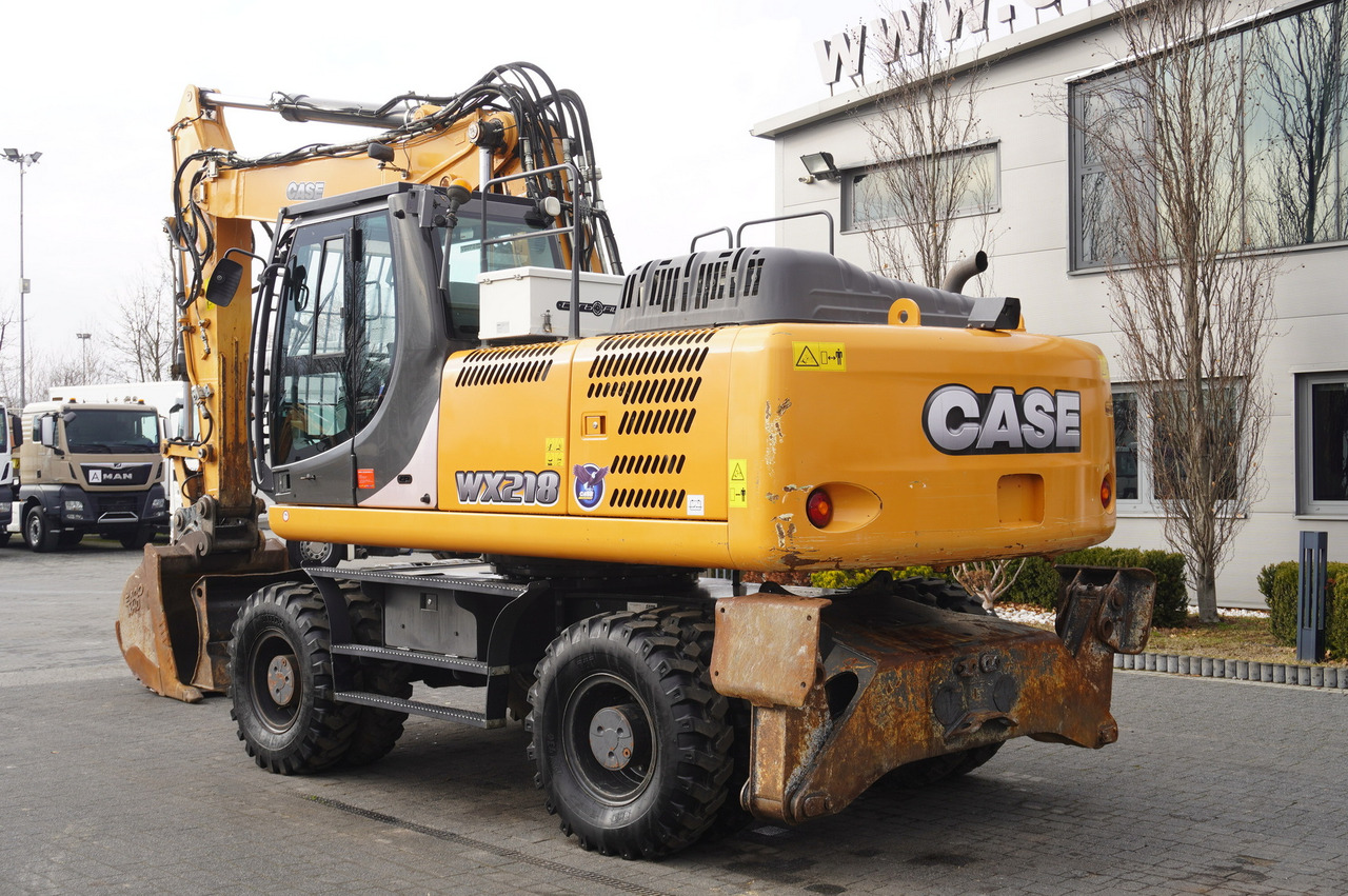 CASE WX218 / 23t wheeled excavator / 3 times folding arm - Pyöräalustainen kaivinkone: kuva CASE WX218 / 23t wheeled excavator / 3 times folding arm - Pyöräalustainen kaivinkone CASE WX218 / 23t wheeled excavator / 3 times folding arm - Pyöräalustainen kaivinkone: kuva CASE WX218 / 23t wheeled excavator / 3 times folding arm - Pyöräalustainen kaivinkone